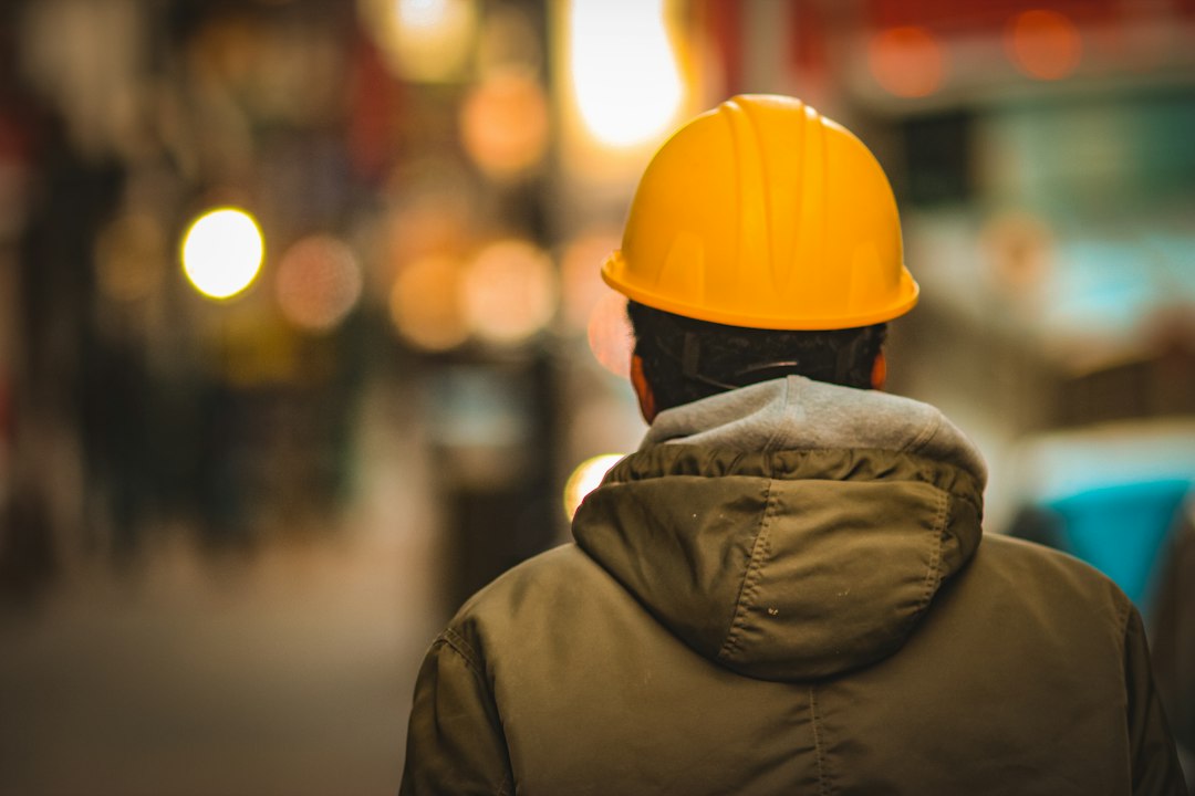 Person wearing a hard hat at a work site