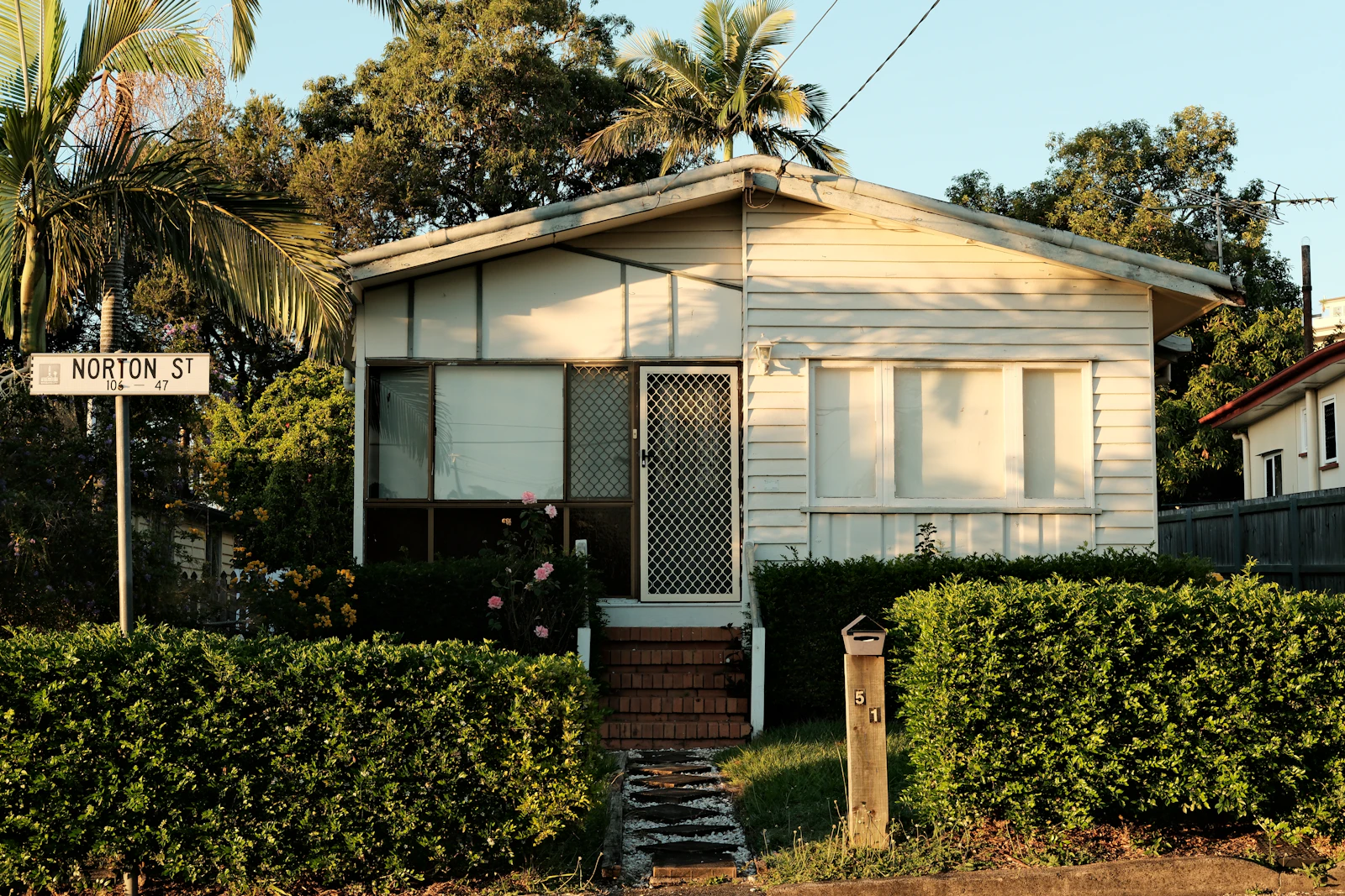 Weatherboard house with a front garden